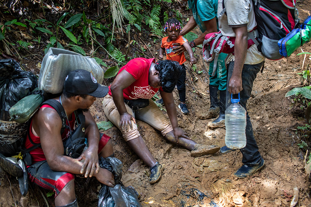An immigrant mother from Haiti collapses after climbing a steep mountain trail