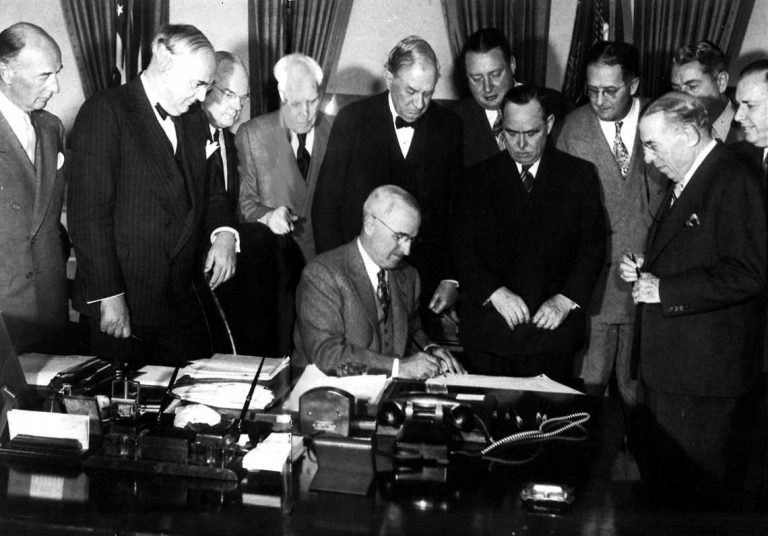 <p>President Harry S. Truman signs the Marshall Plan into law, April 3, 1948.</p>
