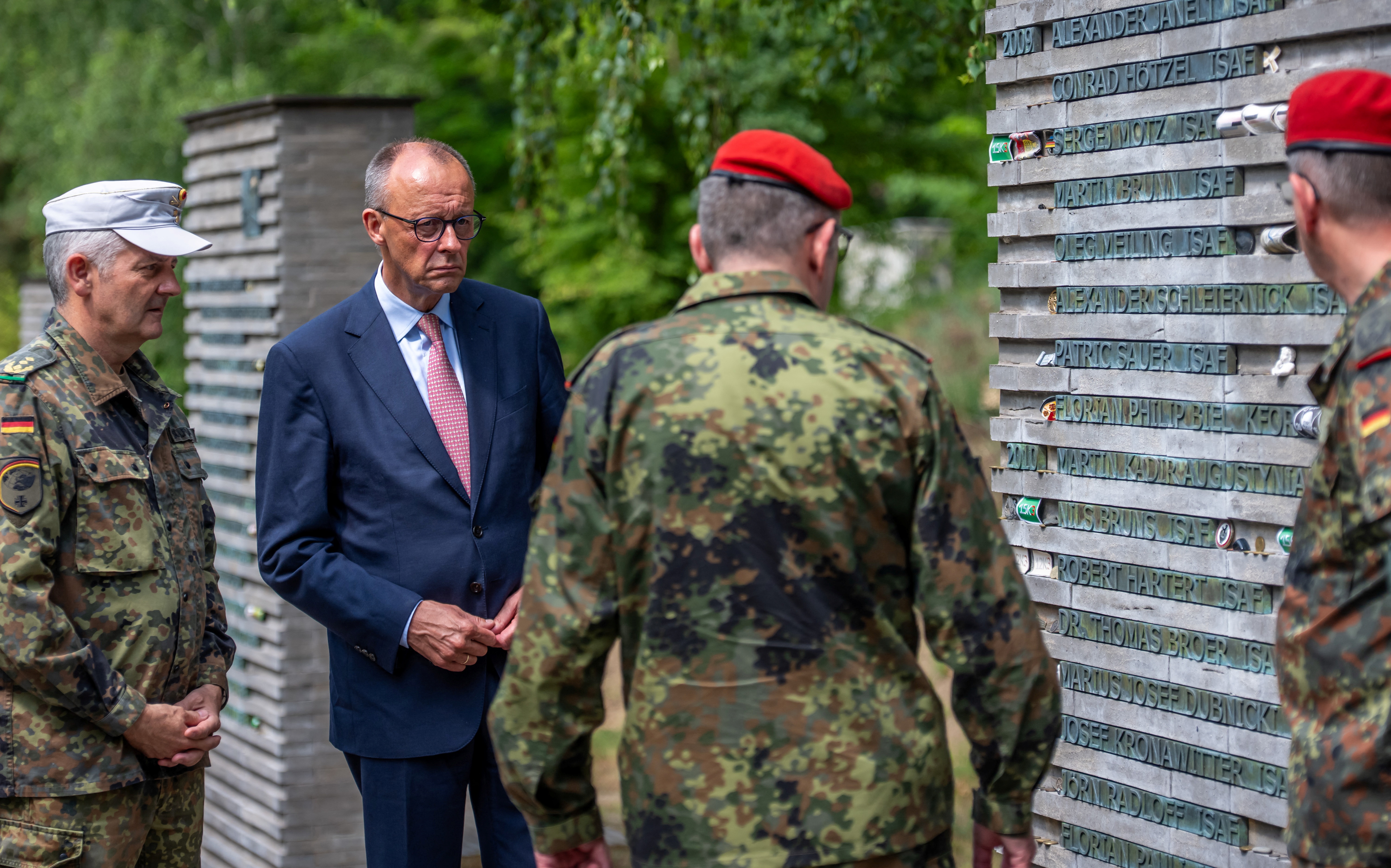 <p>German Chancellor Friedrich Merz talks to soldiers in the so-called “Forest of Remembrance” following his visit to the Operational Command of the German armed forces Bundeswehr in Schwielowsee near Berlin, Germany.</p>