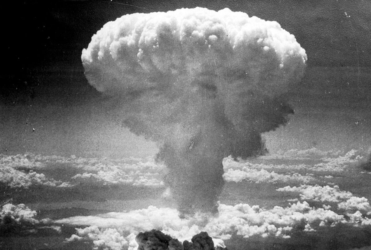<p>Smoke rises over Nagasaki after the atomic bombing, August 9, 1945.</p>
