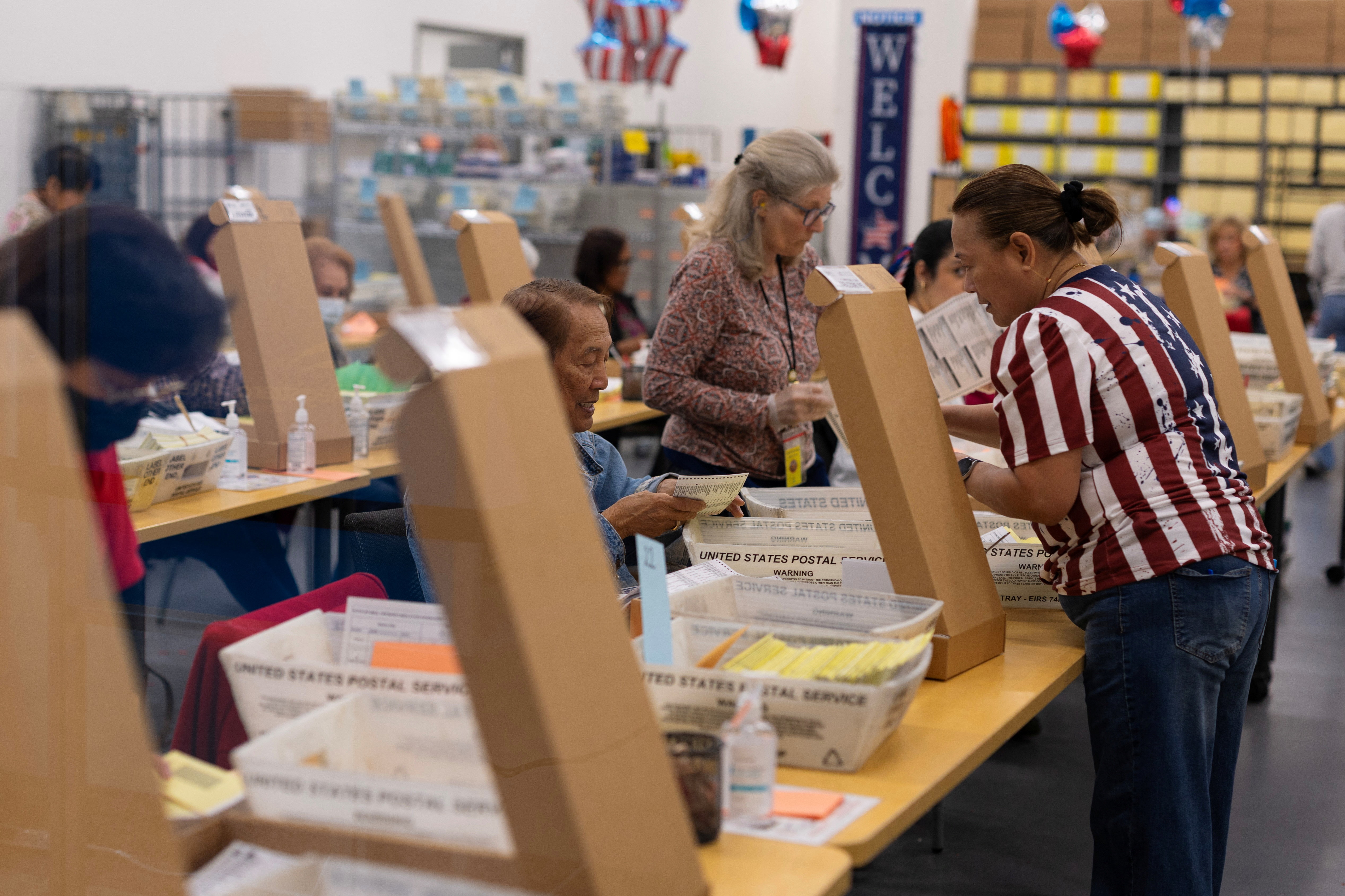 <p>Election workers extract mail-in ballots at the registrar of voters’ office during the California primary election in San Diego, California, June 2, 2026.</p>
