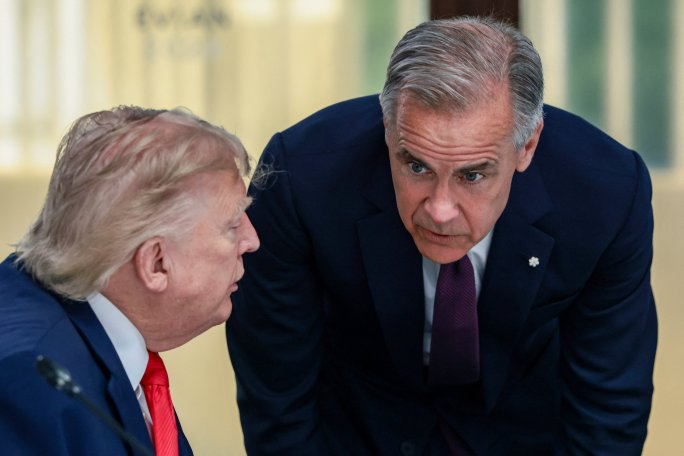 U.S. President Donald Trump speaks with Canadian Prime Minister Mark Carney at a working lunch with leaders of G7 and the Middle East, in Evian-les-Bains, France, June 16, 2026.