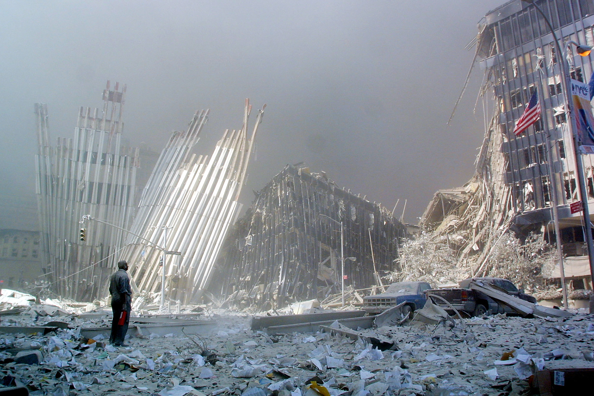 <p>A man calls out asking if anyone needs help after the collapse of the first World Trade Center Tower in New York City, on September, 11, 2001.</p>
